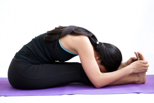 young brunette girl practising yoga isolated on white