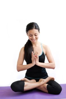 young brunette girl practising yoga isolated on white