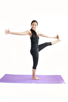 young brunette girl practising yoga isolated on white