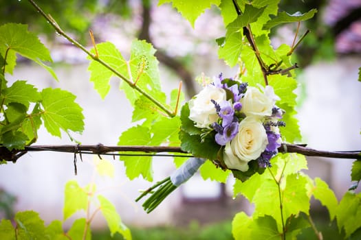 Wedding bouquet with yellow roses and lavender flowers