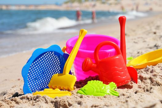 Plastic children toys on the sand beach