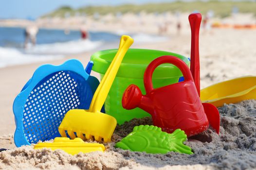 Plastic children toys on the sand beach