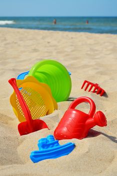 Plastic children toys on the sand beach