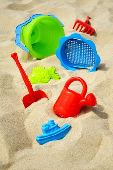 Plastic children toys on the sand beach