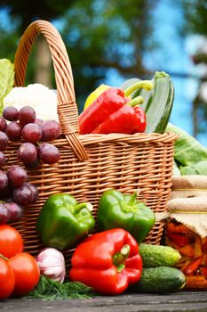 Fresh organic vegetables in wicker basket in the garden