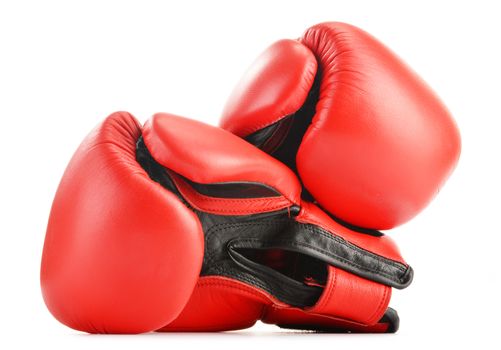 Pair of red leather boxing gloves isolated on white