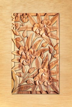 Pattern of flower carved isolated on wood background