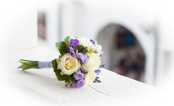 Wedding bouquet with yellow roses and lavender flowers