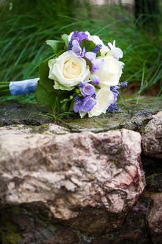 Wedding bouquet with yellow roses and lavender flowers