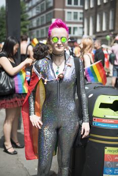 LONDON, UK - JUNE 29: Participant at the gay pride posing for pictures in her shiny outfit in Baker Street. June 29, 2013 in London.