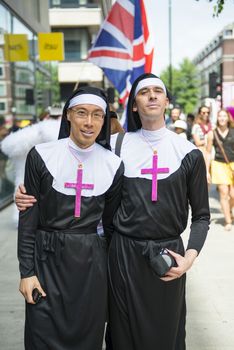 LONDON, UK - JUNE 29: Participant at the gay pride posing for pictures dressed as nuns in Baker Street. June 29, 2013 in London.