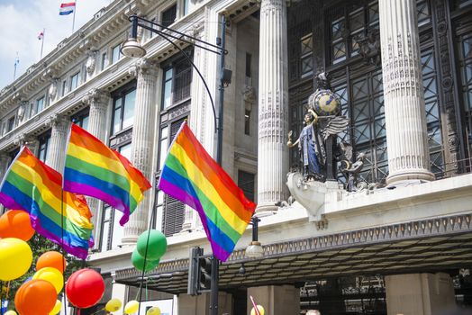 LONDON, UK - JUNE 29: Rainbow flags in front of department store Selfridges at the London Gay Pride parade in Oxford Street. June 29, 2013 in London.