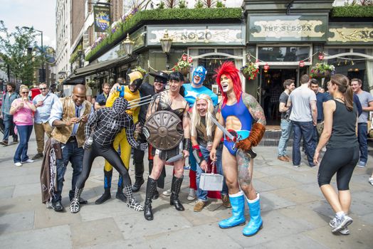 LONDON, UK - JUNE 29: Participants at the gay pride posing for pictures in their superheroes outfits in Leicester Square. June 29, 2013 in London.