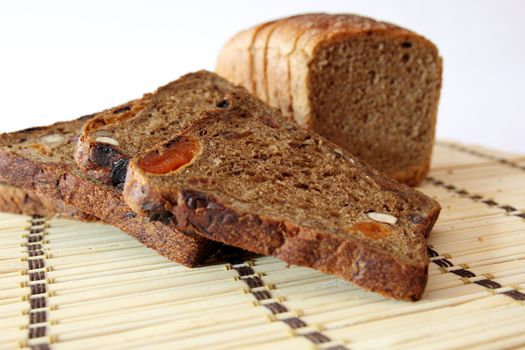 slices of bread on a straw napkin isolated on white background