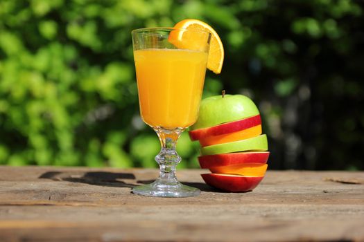 orange juice in a glass with fruit pieces