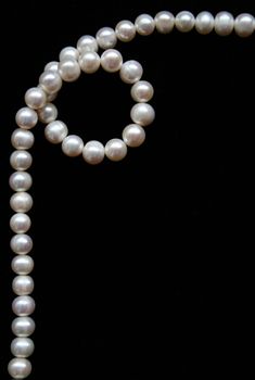 White pearls on the black velvet can use as background