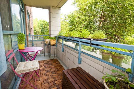 Balcony of condo with patio furniture and plants