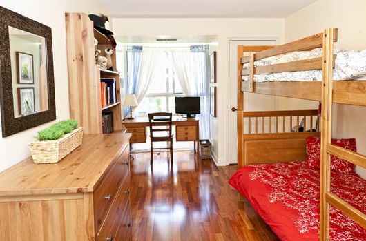 Student bedroom with hardwood floor and bunk beds - artwork is from photographer portfolio