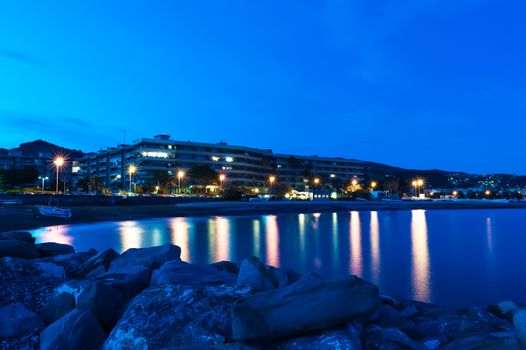 Night view of the waterfront city of Bordighera, Italy