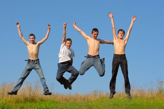 Happy smiling youth group of tennage boys jumping