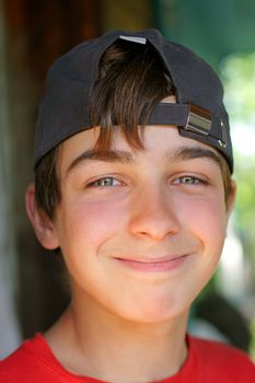 smiling young and happy boy portrait in the cap