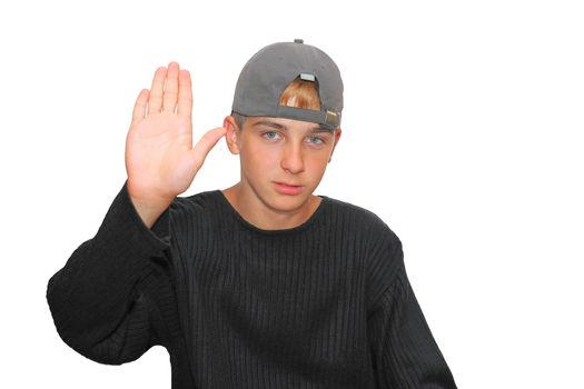 Teenage boy isolated on the white with hand out in stop gesture