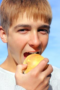 happy teenage boy with the apple