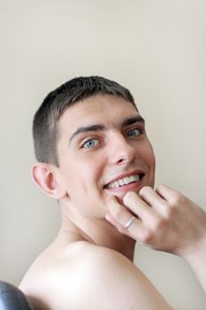 smiling young and happy teenager portrait on the chair