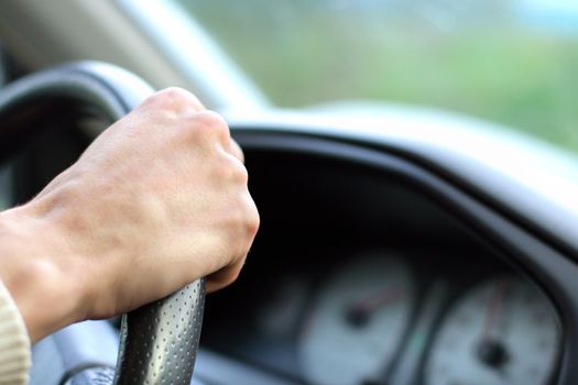 Man with his hand on the wheel