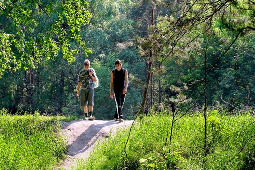 couple teenagers friends walking in the park