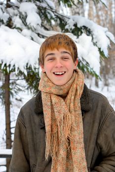 happy smiling teenager in winter forest