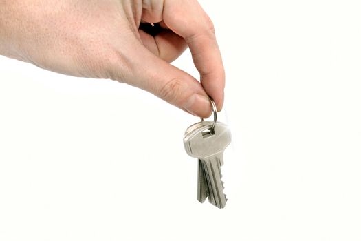 Man holding keys in his hand on white background