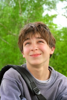 dreamy teenager portrait at the trees background