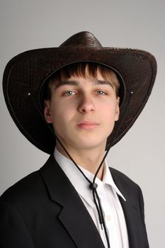 teenager portrait in the studio in the stetson hat