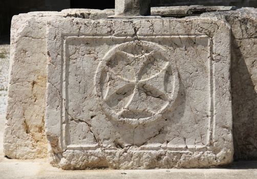 Cross symbol sign of Saint John knights graved in stone
