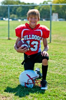 Portrait of a happy youth football player