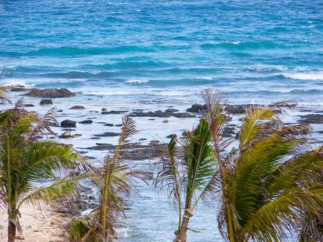 Rocky tropical view overlooking ocean.