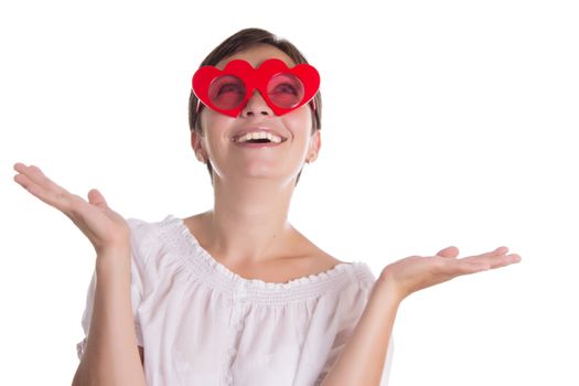 Looking-up surprised woman with funny glasses heart-shaped isolated on white
