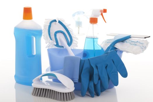 Plastic bucket with cleaning supplies on white background