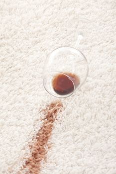 A glass of spilled coffee  on brand new carpet is sure to leave a stain.