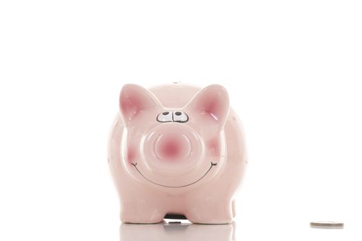 Savings - Piggy bank and hand with coin