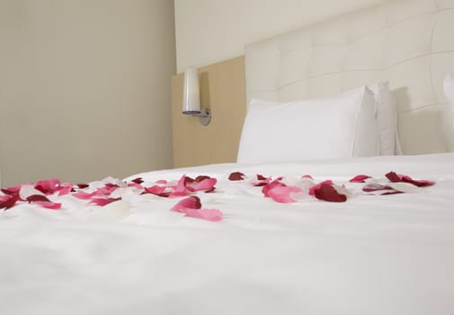 hotel room with big bed and red flowers