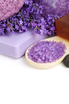 Lavender spa - flowers, salt, soap - health and beauty composition on white background. Empty room for text