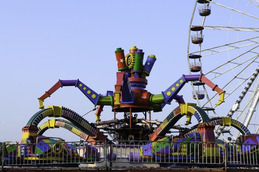 amusement park rides with blue sky background