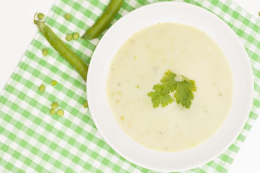 Green Creamy Pea Soup in White Plate