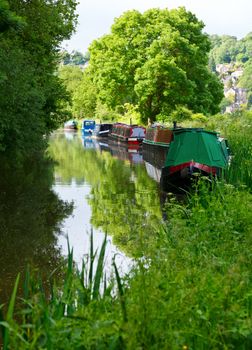 Moored canal boats at the Kennet and Avon Canal in England