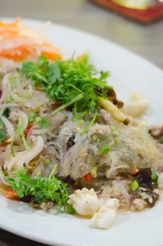 spicy mix seafood salad and vermicelli  , Thai style food .