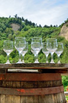 Glasses for wine testing on an old wine barrel