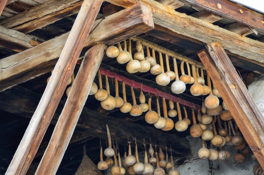 Dried gourds hanging on the beams in a house