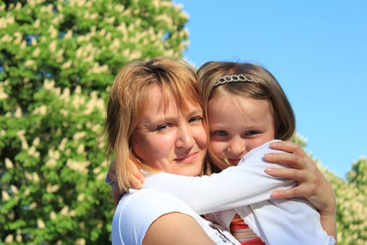 image of mother and daughter are hugging one another